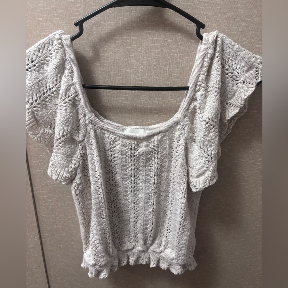 Cute knit off-shoulder top with ruffle trim. Brand is Freshman 1996 Size medium